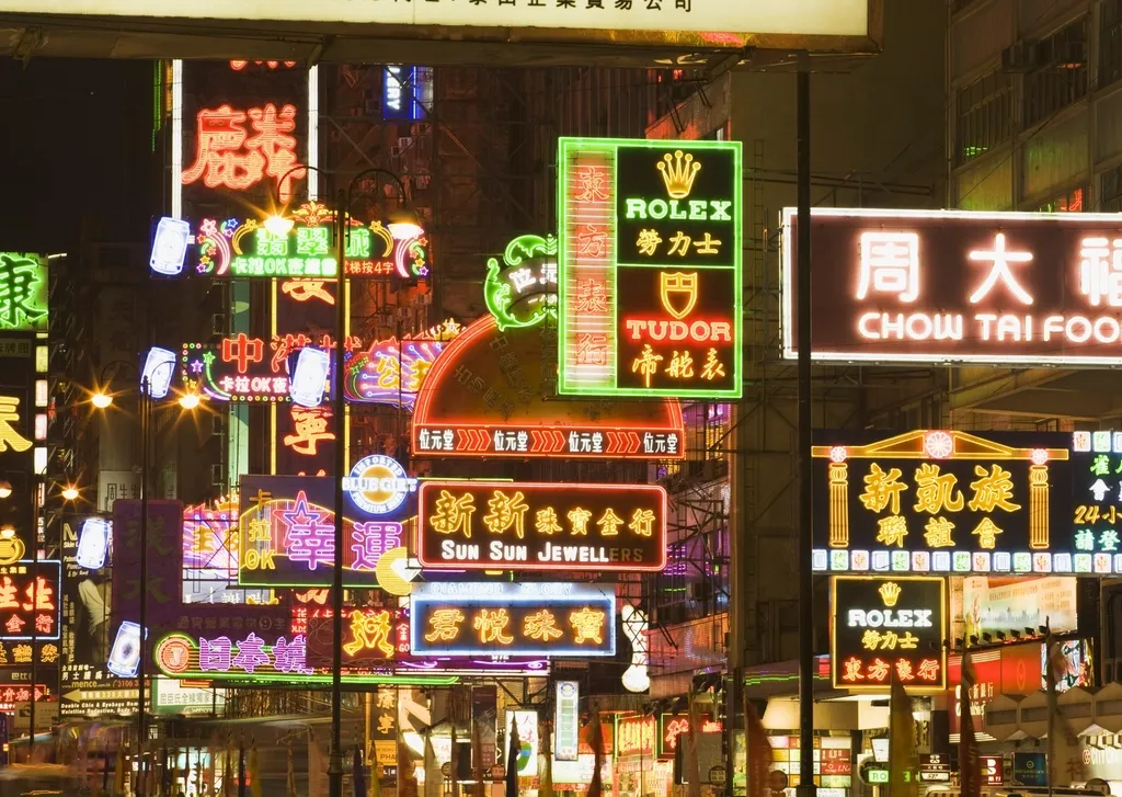 Layers of bright neon signs above a Hong Kong road